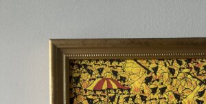 Corner of a canvas in a gold frame